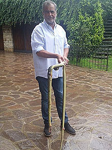 Roberto Calderoli with 6 foot snake found in his home