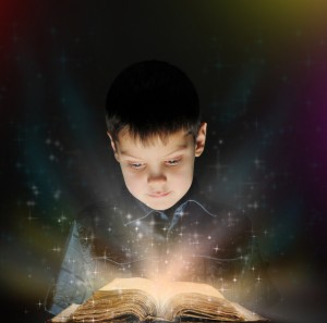 Boy is reading a magic book