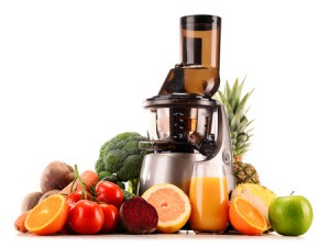 39662845 - slow juicer with organic fruits and vegetables isolated on white