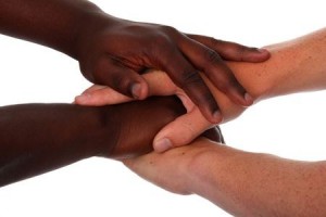 4052942 - hands of black and white males clasped together