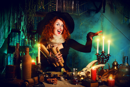 41845986 - attractive witch in the wizarding lair. fairytales. halloween.