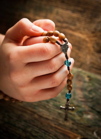 rosary in hand